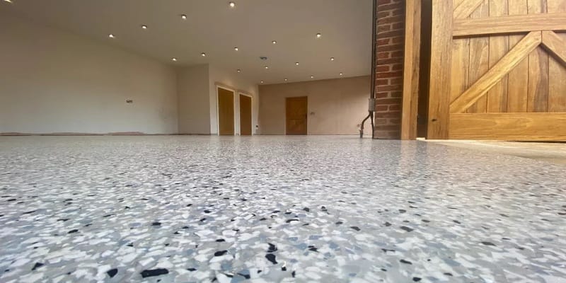 Stone carpet resin bound floor in Bristol with light grey aggregate and black flecks
